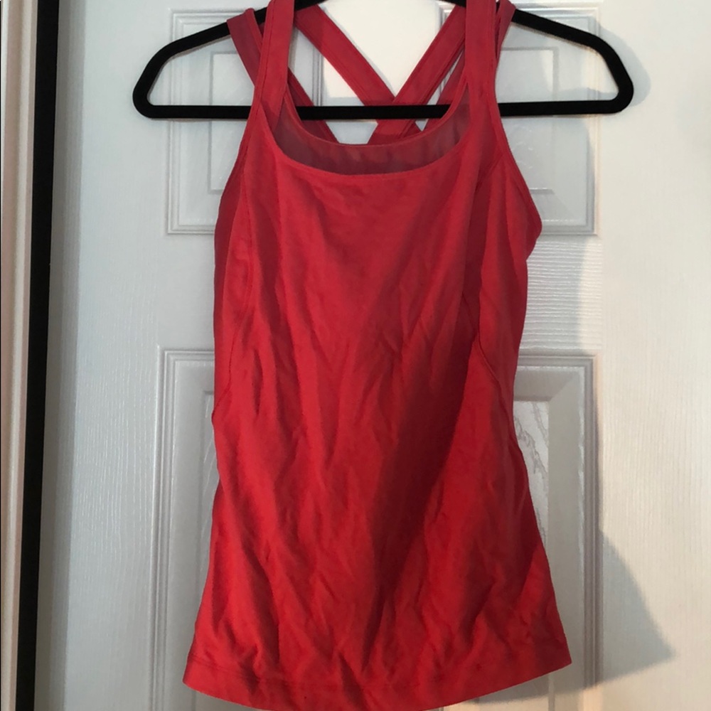 Pink Lululemon workout top with built in bra